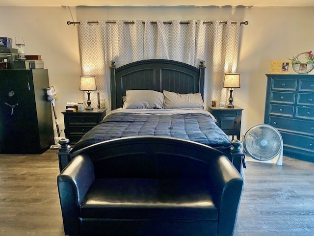 bedroom featuring wood finished floors