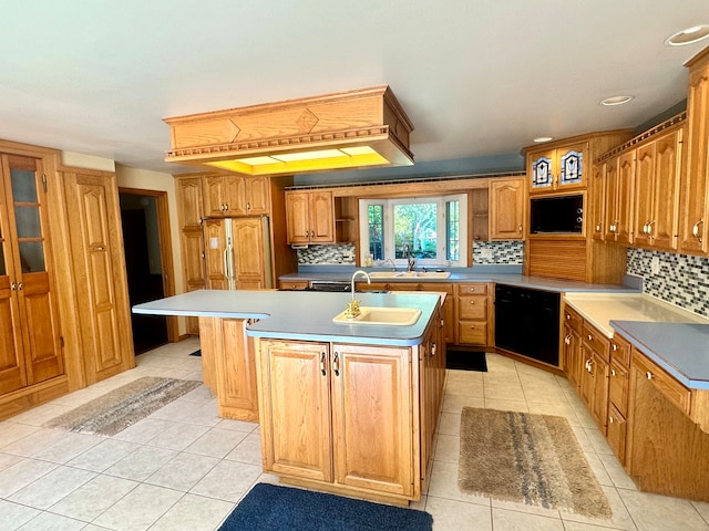 kitchen with black dishwasher, light tile patterned floors, backsplash, an island with sink, and sink