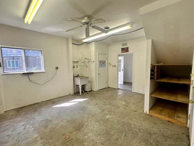 interior space featuring ceiling fan and sink