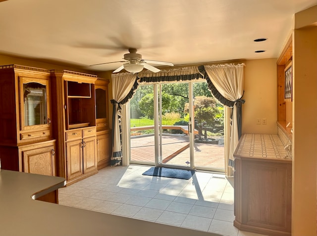 interior space featuring ceiling fan