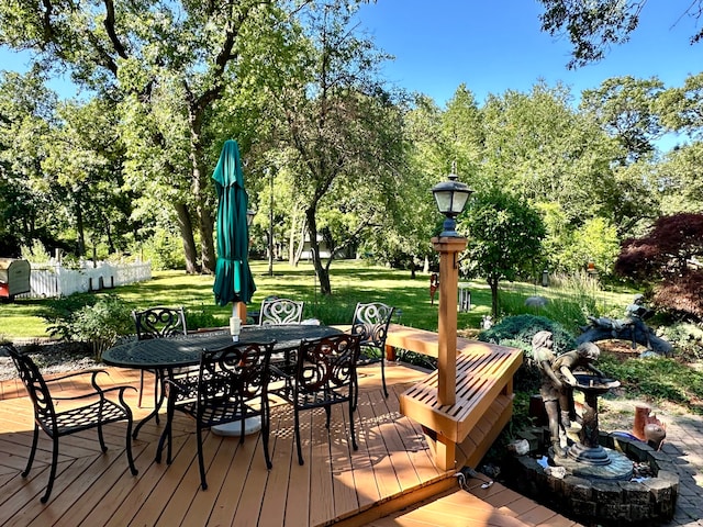 wooden deck with a yard