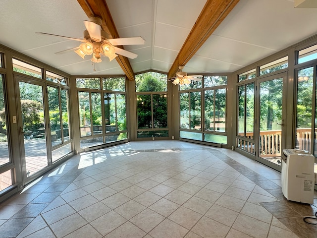 unfurnished sunroom featuring ceiling fan, a wealth of natural light, and lofted ceiling with beams