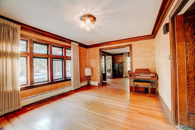 328 E Mulberry St, Watseka, IL 60970 - hall featuring wood finished floors, crown molding, baseboards, and a baseboard heating unit