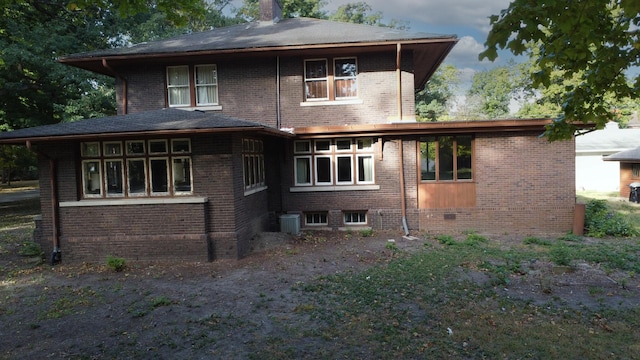 328 E Mulberry St, Watseka, IL 60970 - rear view of house with brick siding, central AC, and a chimney