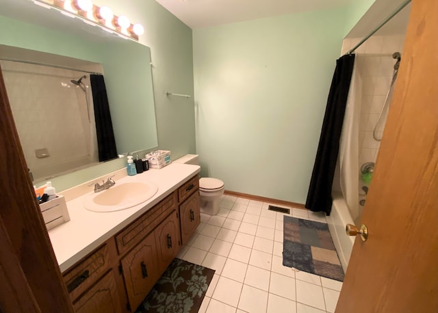 full bathroom featuring tile patterned flooring, vanity, toilet, and shower / bathtub combination with curtain