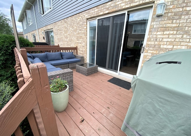 wooden terrace featuring outdoor lounge area