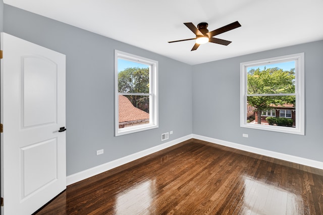 spare room with ceiling fan and hardwood / wood-style flooring