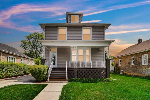 view of front of house featuring a yard and a porch