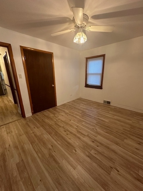 unfurnished bedroom featuring ceiling fan and wood-type flooring