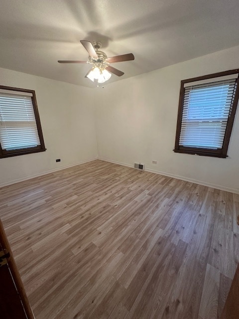 spare room featuring ceiling fan and wood-type flooring