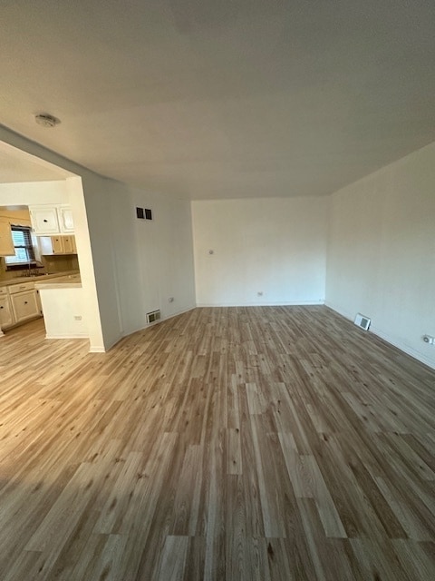 unfurnished room with hardwood / wood-style floors