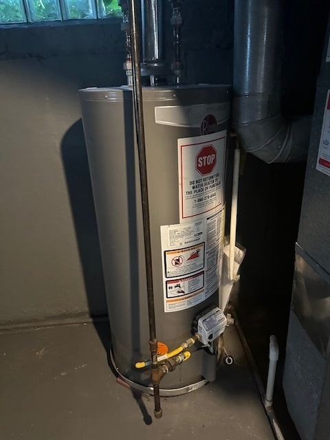 utility room with water heater