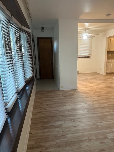 hall with light hardwood / wood-style flooring