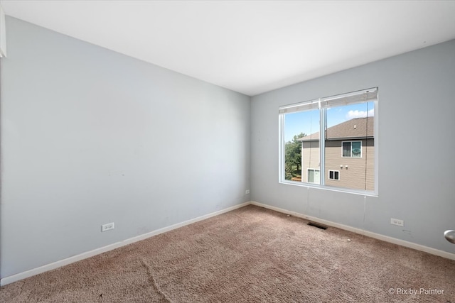 unfurnished room featuring carpet flooring