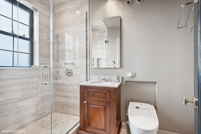 bathroom with vanity, toilet, and walk in shower