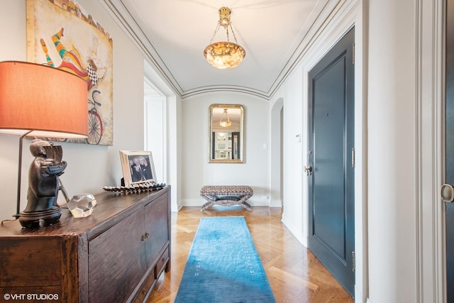 hall with crown molding and light parquet flooring