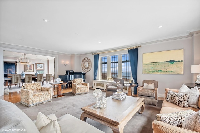 carpeted living room featuring an inviting chandelier and ornamental molding