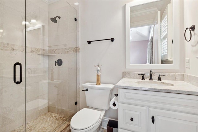 bathroom featuring walk in shower, vanity, and toilet