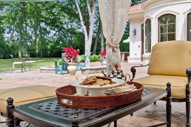 view of patio with an outdoor fire pit