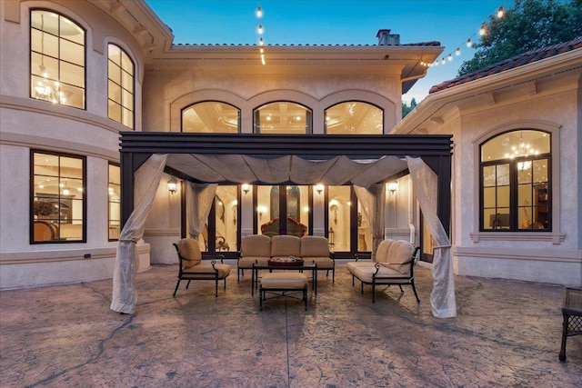 patio terrace at dusk with an outdoor hangout area