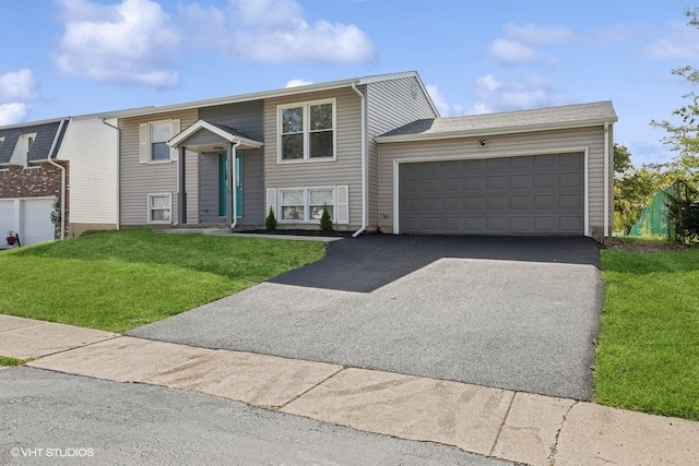 bi-level home with a garage and a front yard