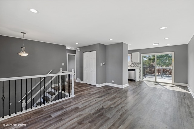 unfurnished living room featuring hardwood / wood-style flooring