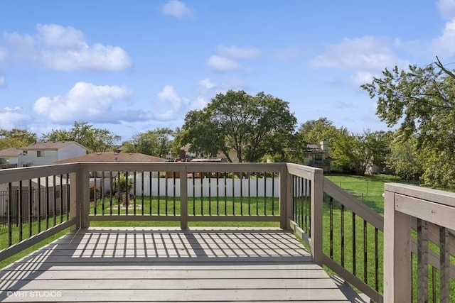 deck featuring a lawn