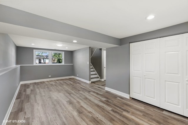 basement with hardwood / wood-style flooring