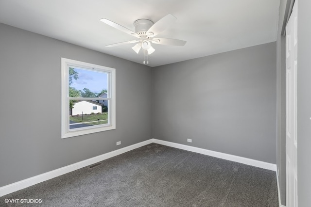 carpeted empty room with ceiling fan