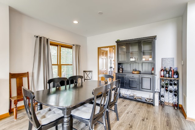 dining room with light hardwood / wood-style flooring