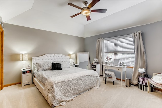 carpeted bedroom featuring ceiling fan and vaulted ceiling