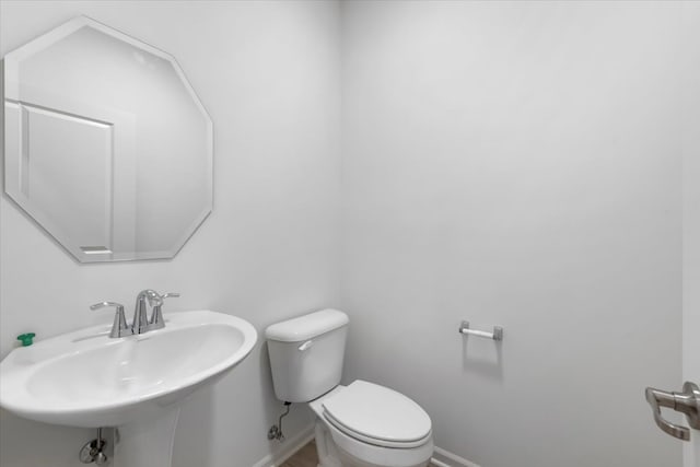 bathroom with sink and toilet