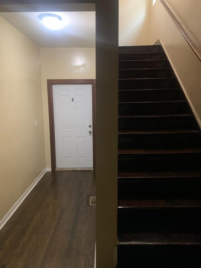 stairway with wood-type flooring