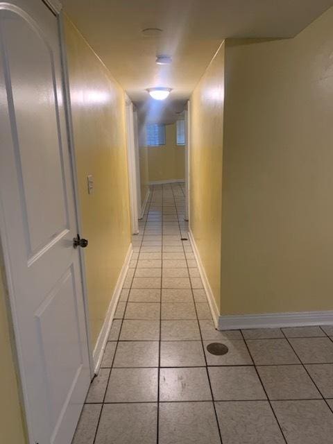 hallway with light tile patterned flooring