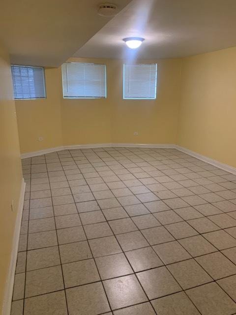 basement with light tile patterned floors