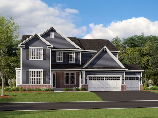 view of front of house featuring a front yard and a garage