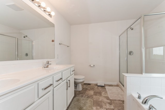 full bathroom featuring toilet, shower with separate bathtub, and vanity