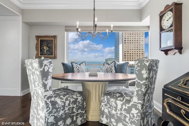 dining space with ornamental molding, dark hardwood / wood-style floors, and a chandelier