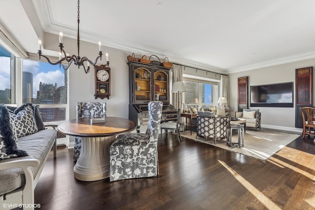 living room with hardwood / wood-style flooring, crown molding, and a chandelier