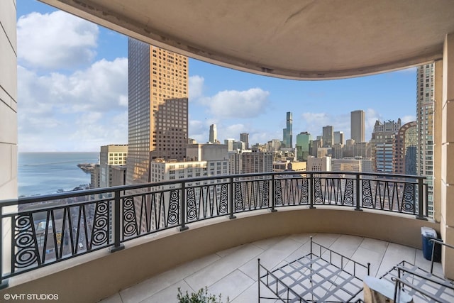 balcony featuring a water view