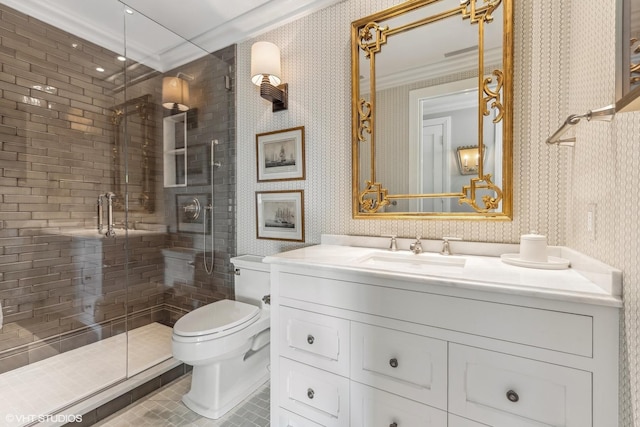 bathroom with vanity, crown molding, a shower with shower door, and toilet