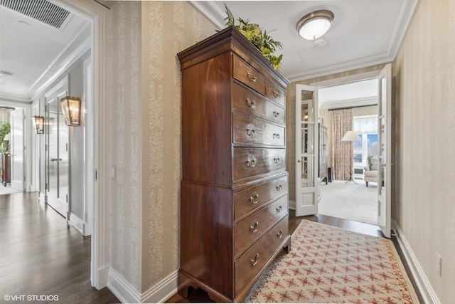 corridor with crown molding and dark hardwood / wood-style flooring