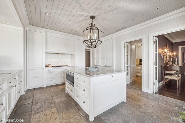 spacious closet with a chandelier