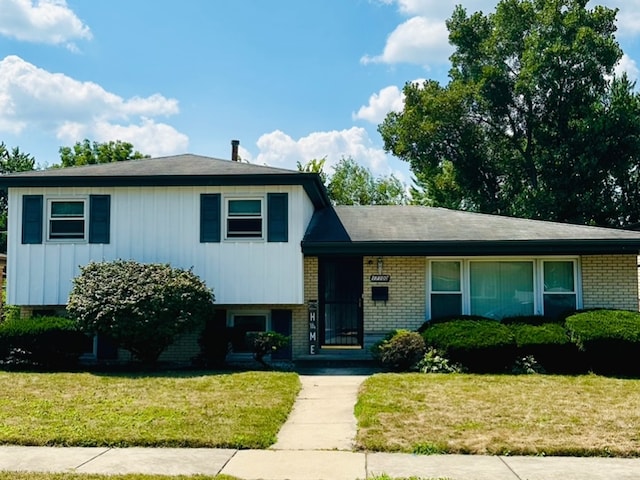 split level home with a front yard