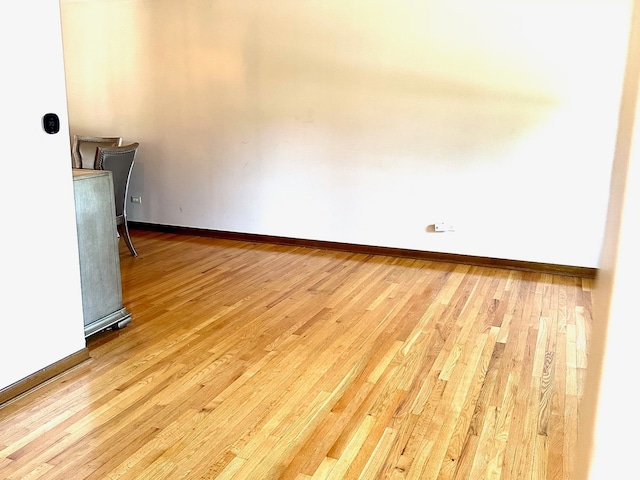 unfurnished room featuring light hardwood / wood-style floors