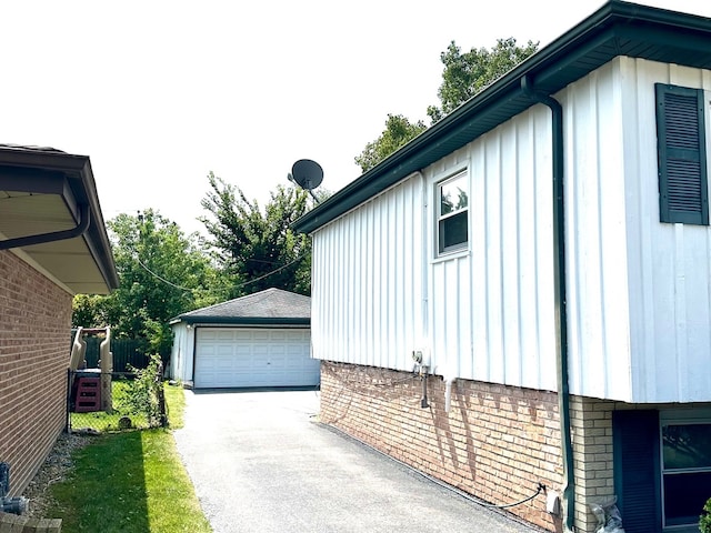 view of property exterior with an outbuilding and a garage