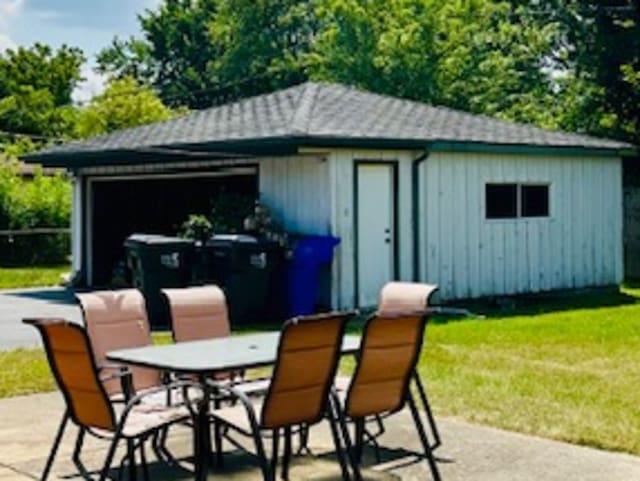 exterior space featuring a garage and a yard