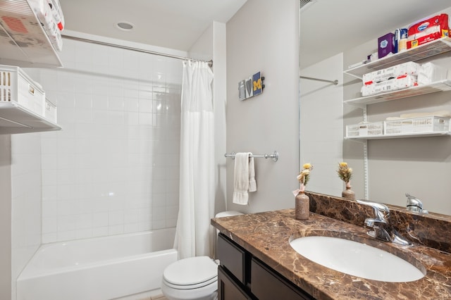 full bathroom featuring shower / tub combo, vanity, and toilet