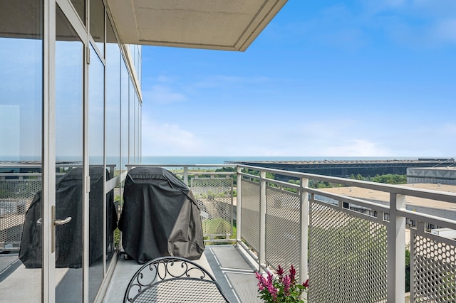 balcony featuring a water view