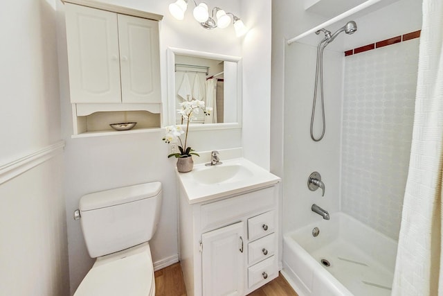 full bathroom with shower / tub combo with curtain, vanity, toilet, and hardwood / wood-style floors